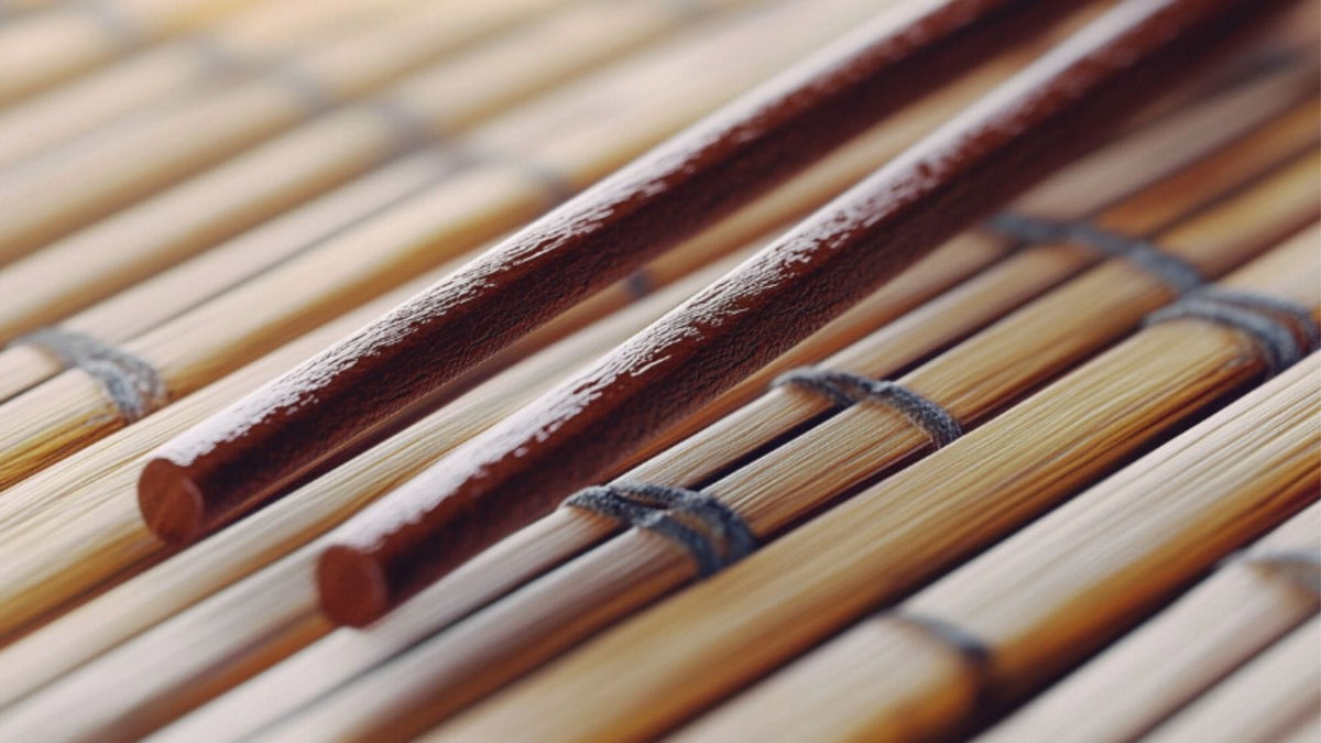A set of chopsticks on a natte