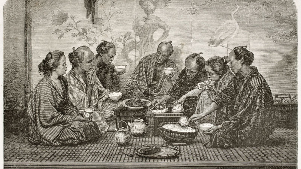 An illustration of a Japanese Family sharing tea around ceramic teapots